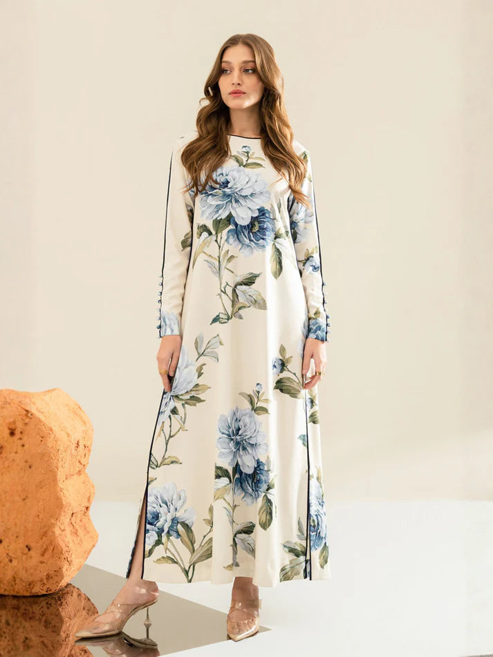 Woman wearing a floral dress with blue flowers on a neutral background