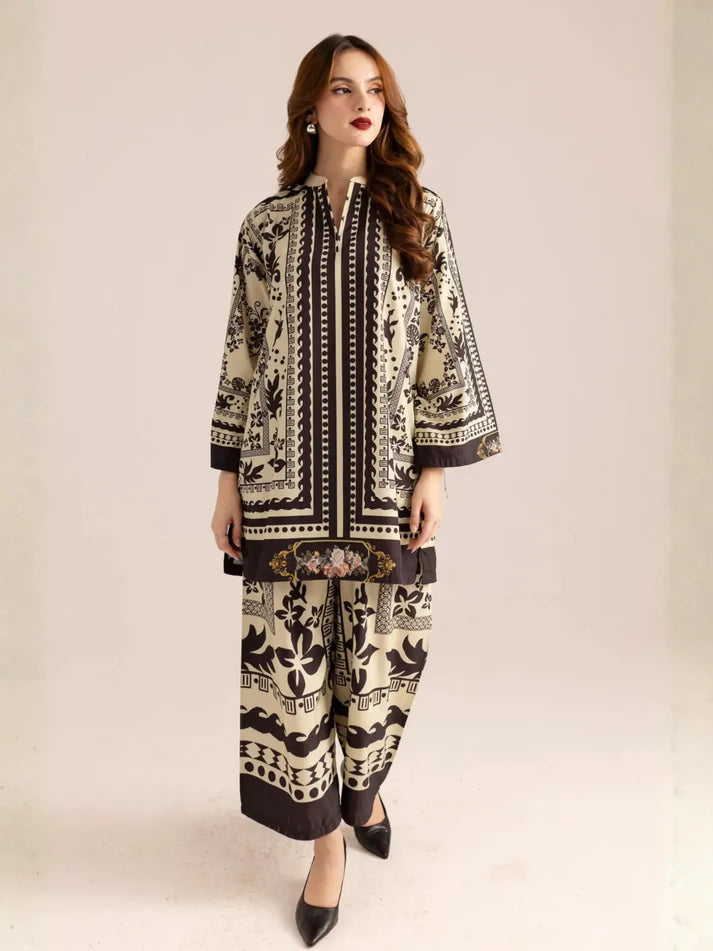 Woman wearing a patterned outfit on a plain background