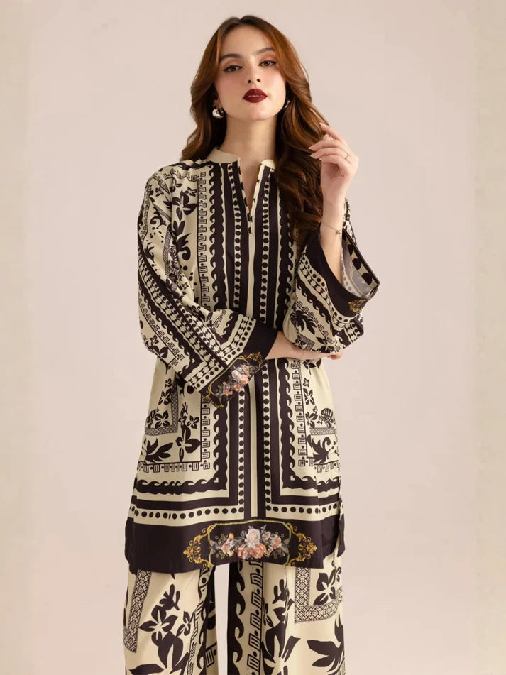 Woman wearing a black and white patterned outfit on a beige background