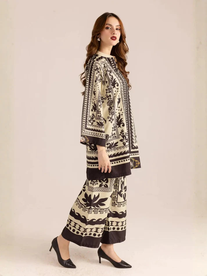 Woman wearing a black and white patterned outfit on a beige background